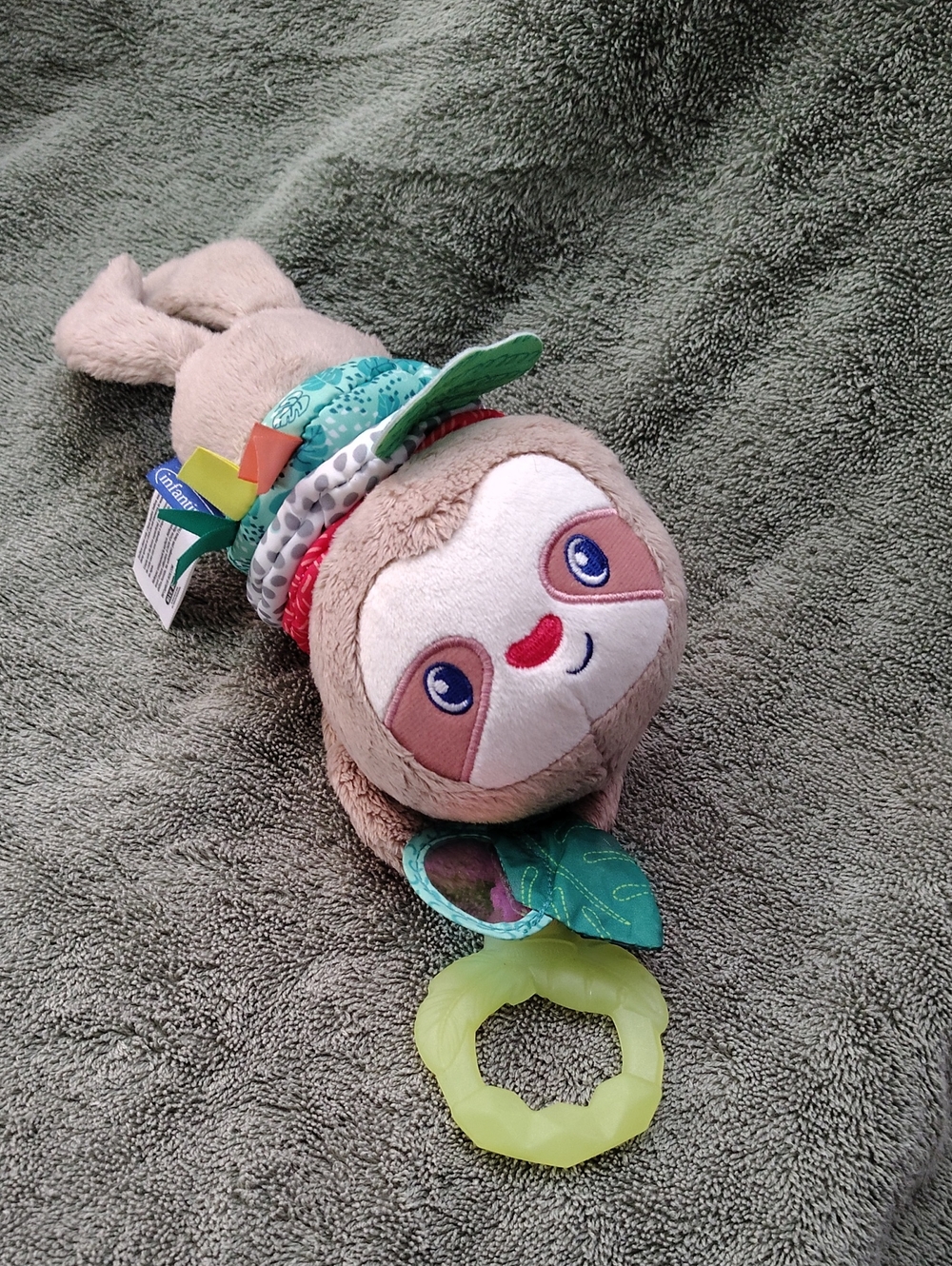 Infantino Plush Music and Motion Sloth Toy in Taupe with Green Accents
